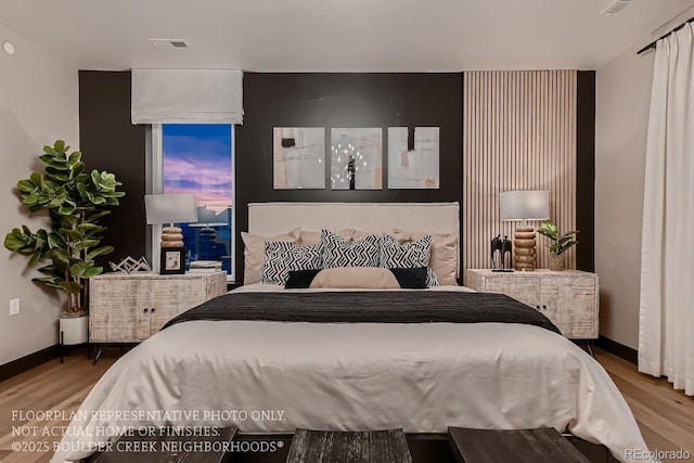 bedroom with wood-type flooring