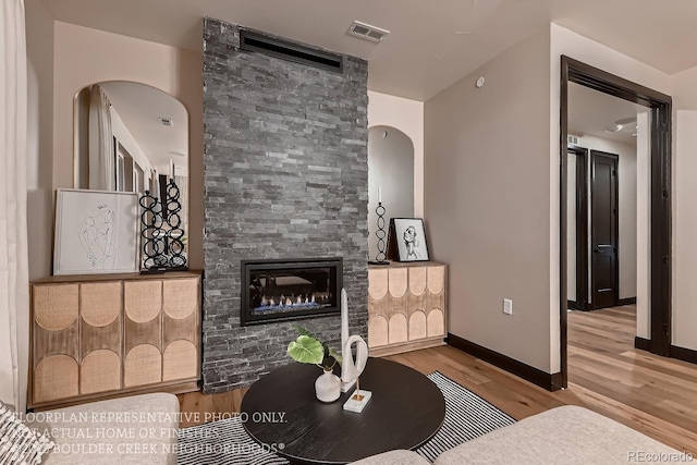 living room featuring a fireplace and hardwood / wood-style floors