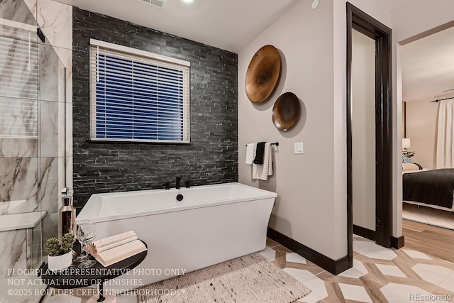 bathroom featuring a bathing tub and tile patterned floors