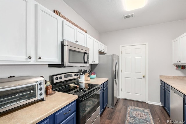 4451 S Ammons St Unit 5-307, Littleton, CO 80123 - kitchen with a toaster, dark wood-type flooring, white cabinetry, stainless steel appliances, and blue cabinetry