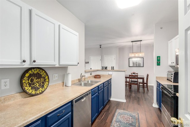 4451 S Ammons St Unit 5-307, Littleton, CO 80123 - kitchen featuring blue cabinets, a sink, white cabinets, dark wood-style floors, and stainless steel appliances