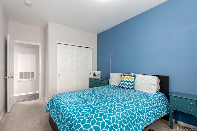 4451 S Ammons St Unit 5-307, Littleton, CO 80123 - carpeted bedroom with a closet, baseboards, and visible vents