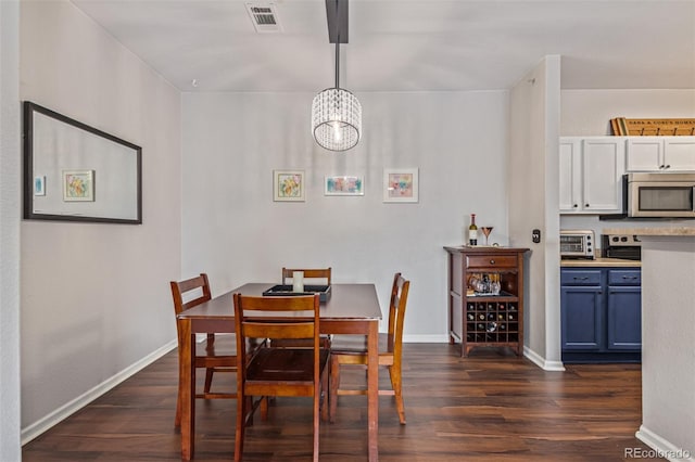 4451 S Ammons St Unit 5-307, Littleton, CO 80123 - dining area with dark wood-style floors and a chandelier