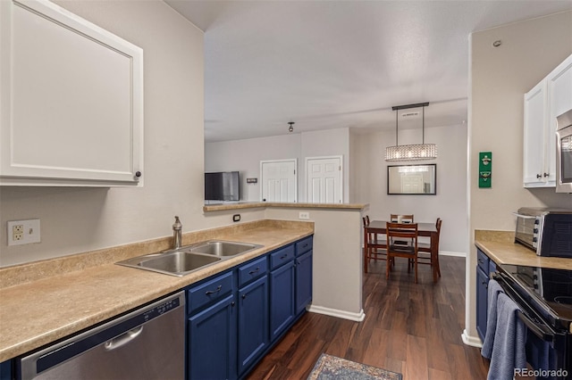 4451 S Ammons St Unit 5-307, Littleton, CO 80123 - kitchen featuring stainless steel appliances, blue cabinets, white cabinetry, dark wood-style floors, and light countertops