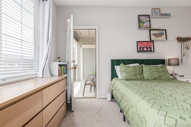 4451 S Ammons St Unit 5-307, Littleton, CO 80123 - bedroom with multiple windows and light carpet