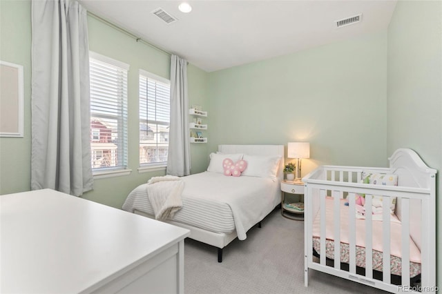 bedroom featuring carpet and visible vents