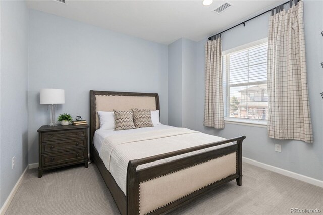 bedroom with light carpet, baseboards, and visible vents