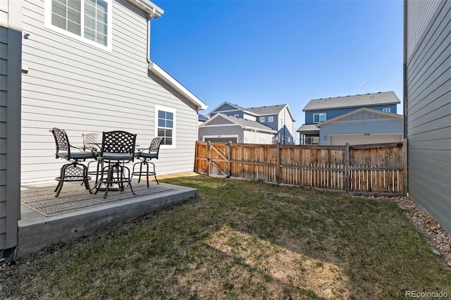 view of yard with fence and a patio