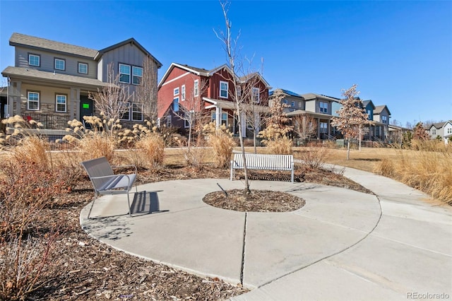 view of patio / terrace featuring a residential view and driveway