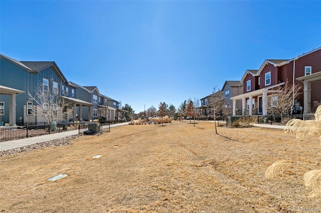 exterior space with fence and a residential view