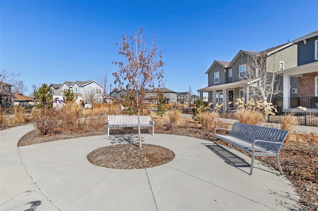 view of patio featuring a residential view and fence