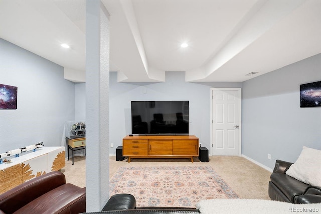 carpeted living room with visible vents, baseboards, and recessed lighting