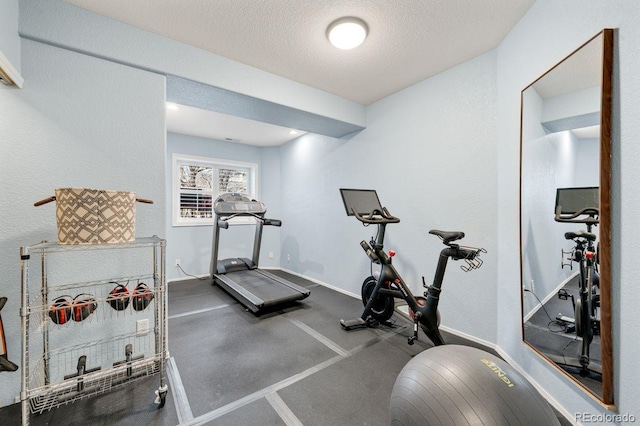 workout room with a textured ceiling