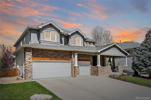 craftsman-style house featuring a porch, stone siding, a garage, fence, and concrete driveway