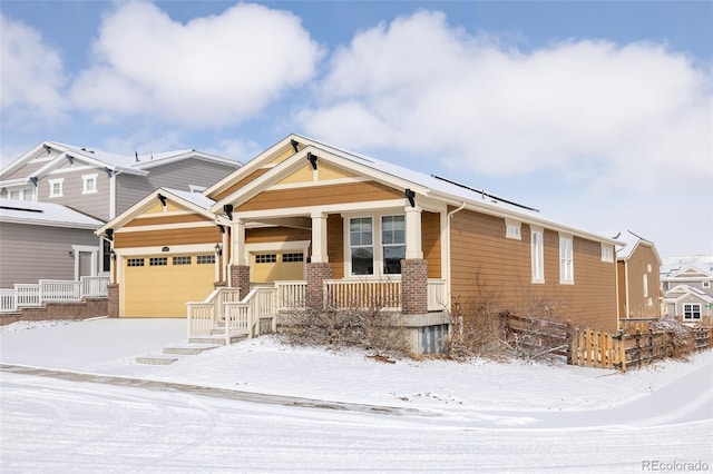 craftsman-style house with a garage and covered porch