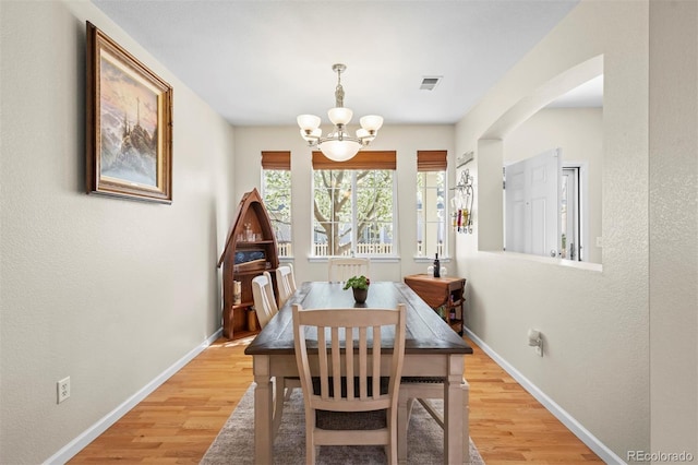 17808 E 104th Pl Unit C, Commerce City, CO 80022 - dining area featuring a chandelier and light wood-style floors