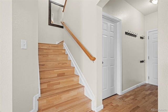 17808 E 104th Pl Unit C, Commerce City, CO 80022 - stairway featuring wood finished floors and arched walkways