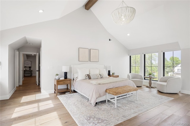 3147 Juniper Ct, Golden, CO 80401 - bedroom with high vaulted ceiling, beam ceiling, a chandelier, baseboards, and light wood-style flooring
