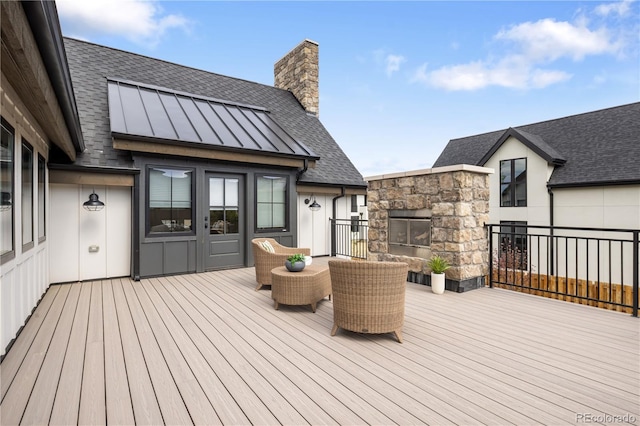 3147 Juniper Ct, Golden, CO 80401 - wooden terrace featuring a fireplace and french doors
