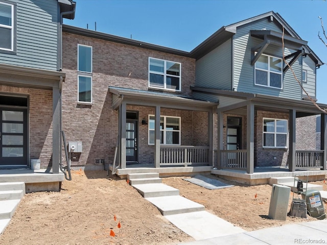 townhome / multi-family property with covered porch