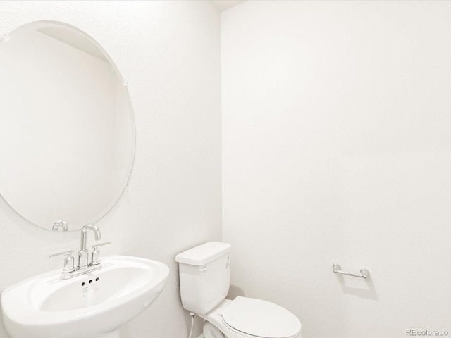 bathroom with toilet and sink