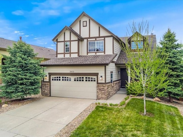 2833 Open Sky Way, Castle Rock, CO 80109 - tudor house featuring an attached garage, concrete driveway, a front yard, brick siding, and a shingled roof