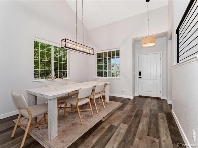 2833 Open Sky Way, Castle Rock, CO 80109 - dining room with high vaulted ceiling, dark wood finished floors, plenty of natural light, and baseboards