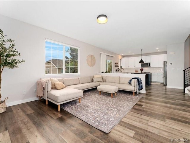 2833 Open Sky Way, Castle Rock, CO 80109 - living area with dark wood-type flooring, baseboards, and recessed lighting