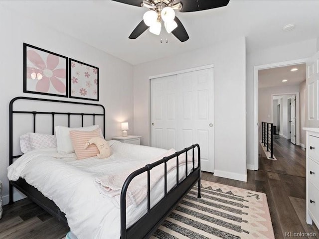 2833 Open Sky Way, Castle Rock, CO 80109 - bedroom featuring dark wood-style flooring, a closet, baseboards, ceiling fan, and recessed lighting