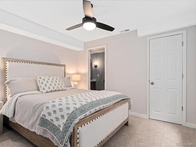 2833 Open Sky Way, Castle Rock, CO 80109 - bedroom with baseboards, light colored carpet, ceiling fan, and connected bathroom