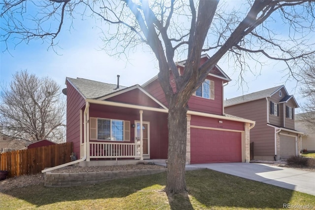 traditional-style home featuring a porch, fence, concrete driveway, an attached garage, and a shingled roof