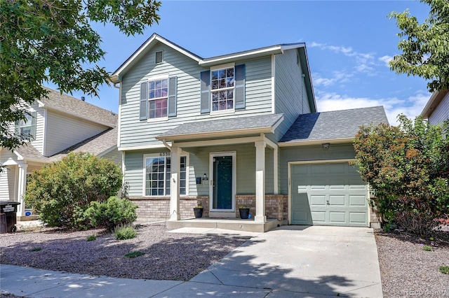 6330 Rockville Dr, Colorado Springs, CO 80923 - view of front of home featuring an attached garage, driveway, a shingled roof, and a porch