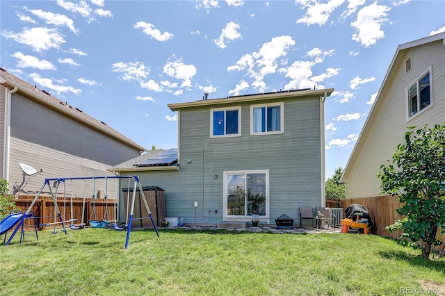 6330 Rockville Dr, Colorado Springs, CO 80923 - back of house with a playground and a fenced backyard