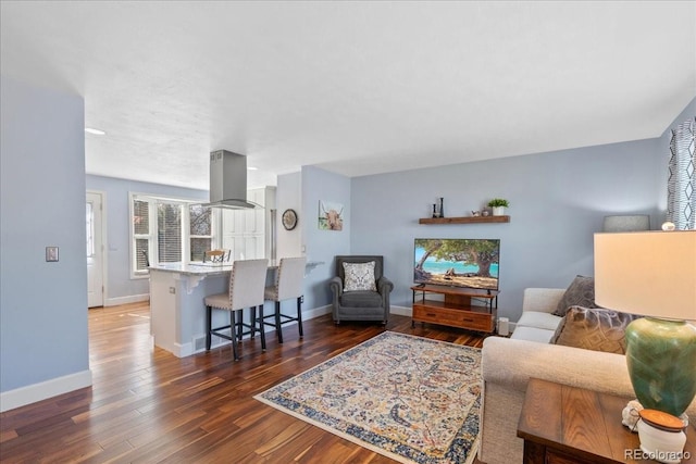 living room with baseboards and wood finished floors