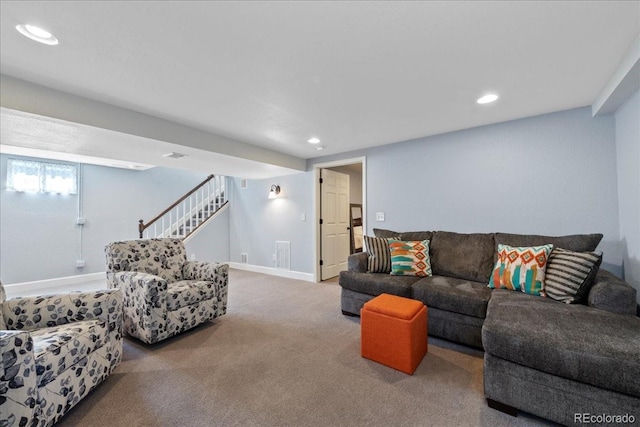 living area featuring carpet floors, recessed lighting, and visible vents
