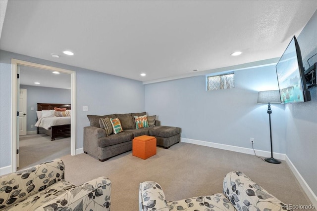 living area with recessed lighting and carpet flooring