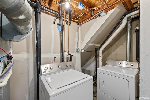 laundry room with laundry area and washing machine and clothes dryer