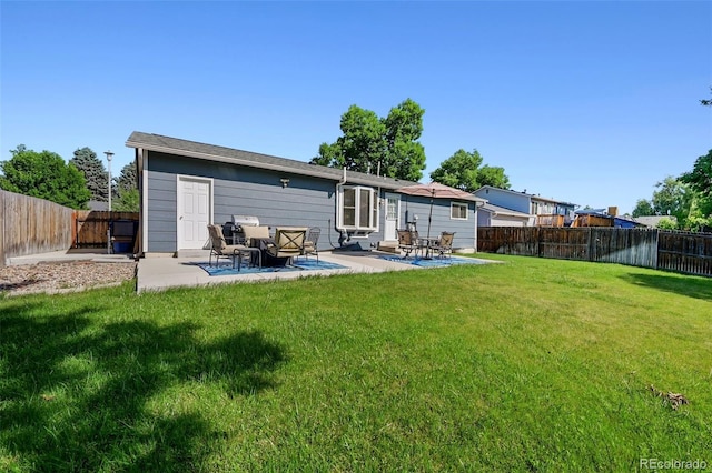 6074 S Dudley Way, Littleton, CO 80123 - rear view of house with a fenced backyard and a patio area