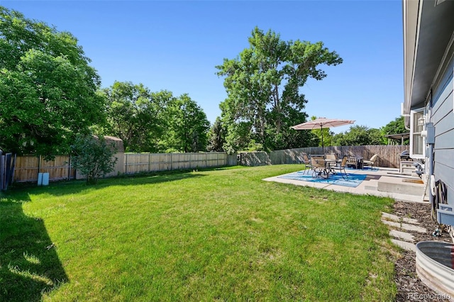 6074 S Dudley Way, Littleton, CO 80123 - fenced backyard featuring a patio