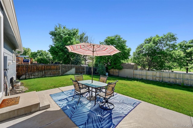 6074 S Dudley Way, Littleton, CO 80123 - fenced backyard featuring a patio area and outdoor dining space