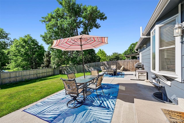 6074 S Dudley Way, Littleton, CO 80123 - fenced backyard featuring a patio and outdoor dining space