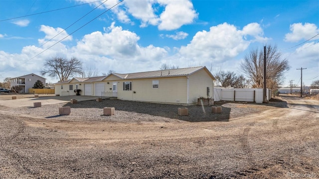 view of side of home with a garage