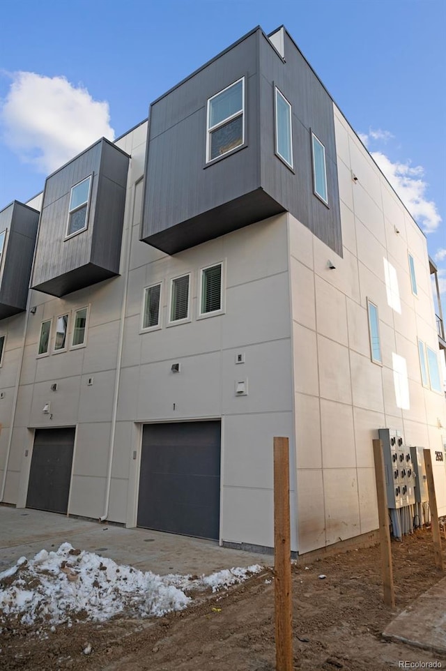 2620 S Delaware St Unit 2, Denver, CO 80223 - view of home's exterior featuring an attached garage