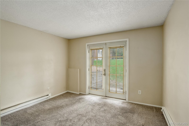 carpeted empty room with a textured ceiling and baseboard heating