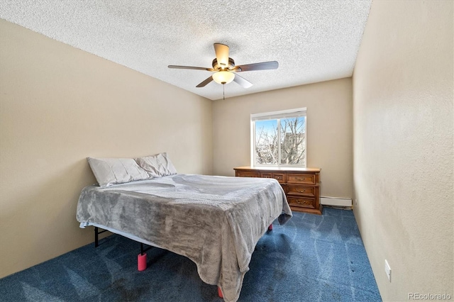 bedroom with a baseboard heating unit, dark colored carpet, a textured ceiling, and ceiling fan