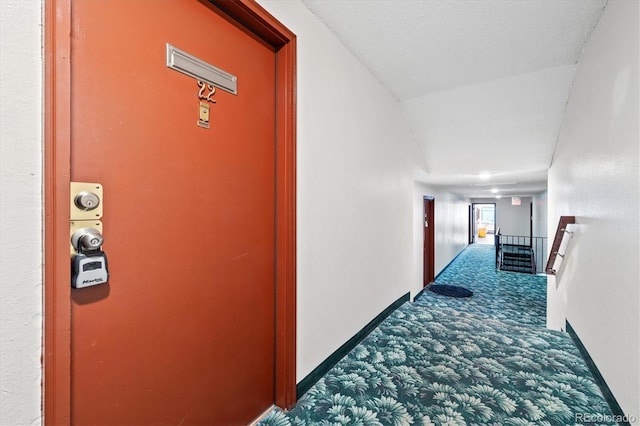 corridor featuring carpet flooring