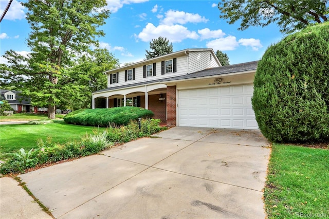 front facade with a garage and a front lawn