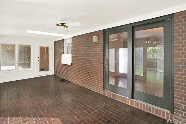 interior space featuring ceiling fan