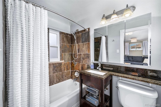 full bathroom with vanity, shower / bath combination with curtain, and toilet