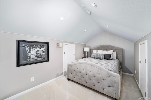 carpeted bedroom with vaulted ceiling, visible vents, and baseboards